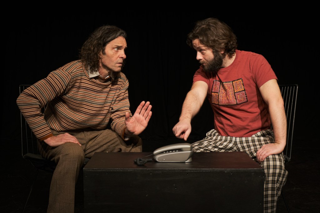 Elling and Kjell Bjarne confronting the telephone in their Oslo apartment.